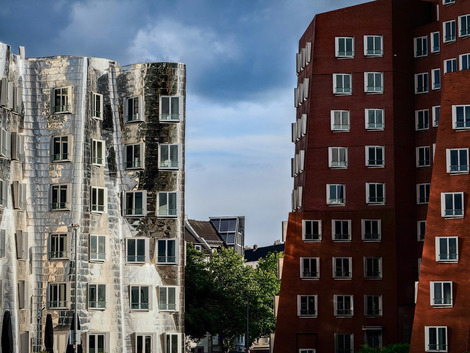 Dusseldorf Rhine waterfront with the Rheinturm tower and MedienHafen architecture at sunset